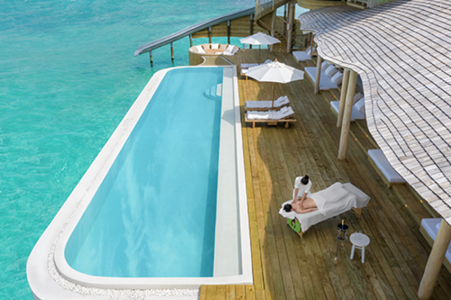 Hero Soneva Jani 2BR Water Reserve aerial shot of deck and massage treatment by Sandro Bruecklmeier.