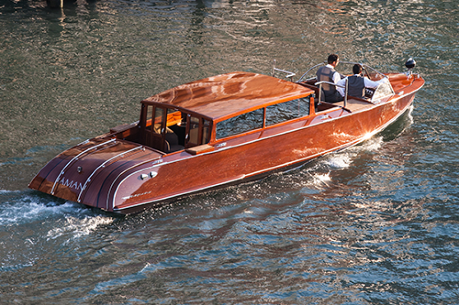 Aman Canal Grande boat. credit Basil PaoAmanresorts